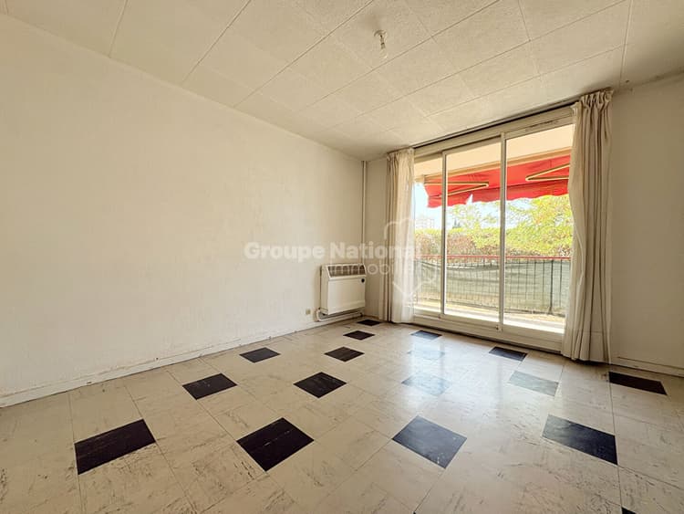 Appartement 3 pièces- 63 m² - 2 Chambres - Proche écoles- commerces- balcon- rdc- cave.